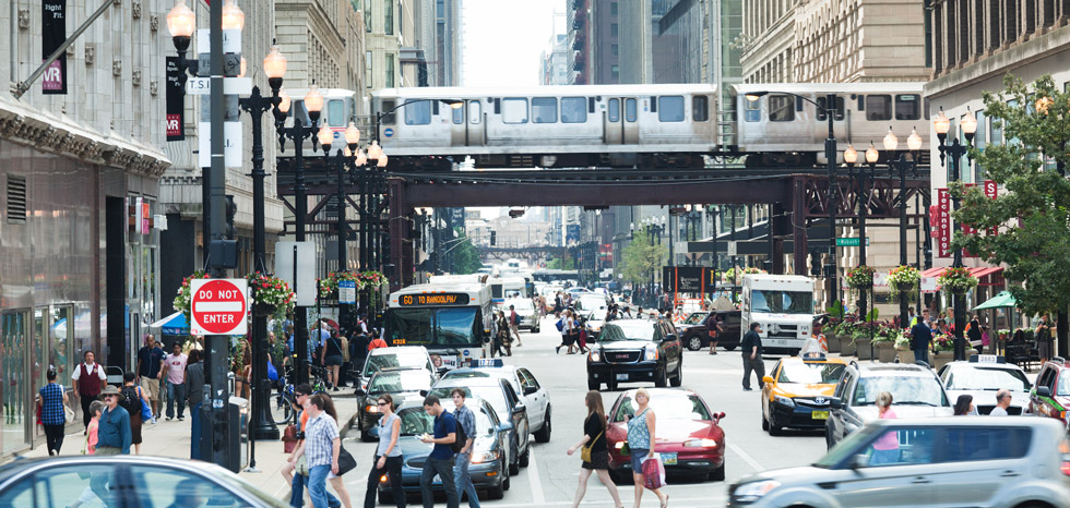 Urban streetscape with subway and pedestrians