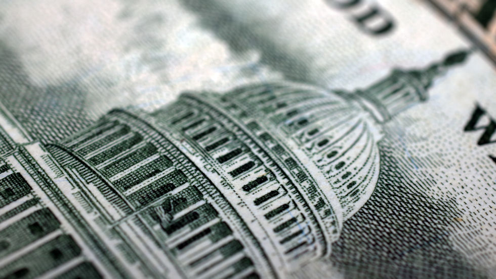 Close-up of U.S. Capitol shown on U.S. currency.