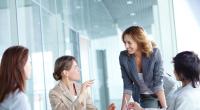 Image of four businesswomen interacting at meeting