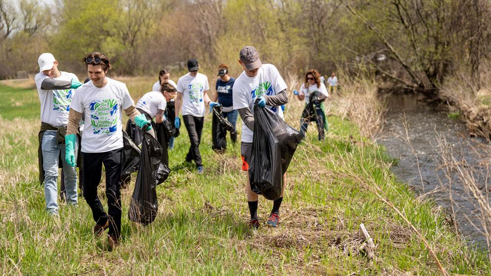 Healthpeak employees at a river cleanup event