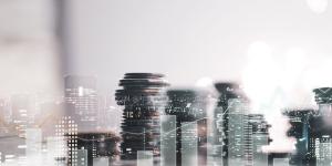 Collage image of stacks of coins and office skyline.